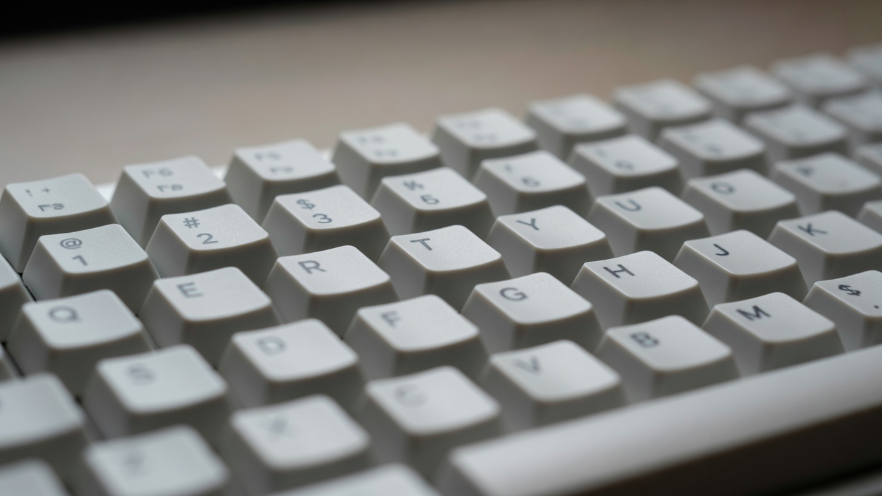 Shallow-focus keycaps with ordinary lettering, no brand logo